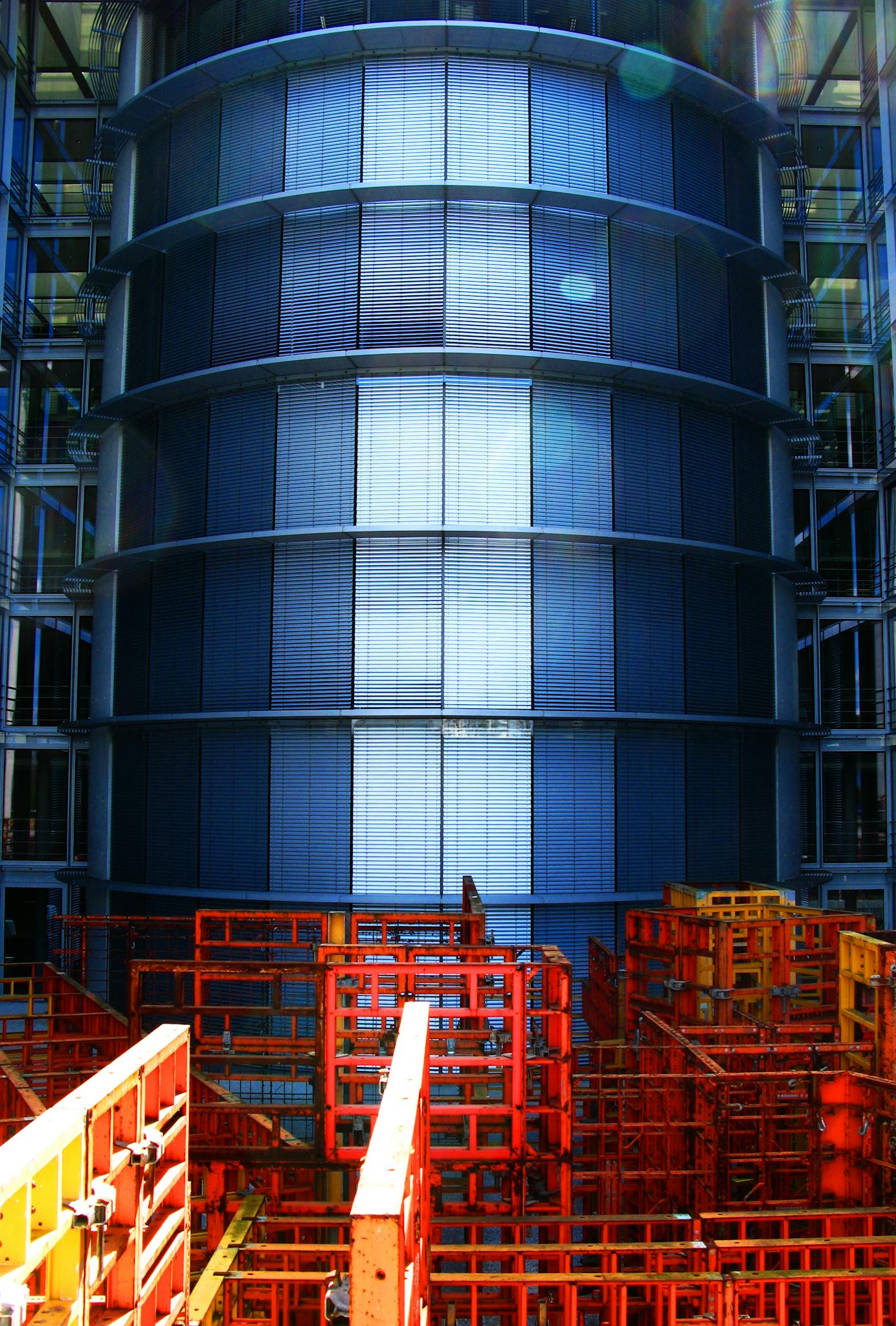 Close-up of a large industrial storage tank showcasing intricate metal structures in vertical alignment.